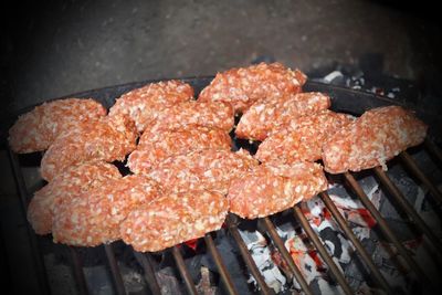 High angle view of meat on barbecue grill