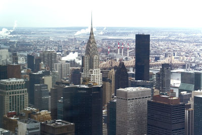 High angle view of modern buildings in city against sky