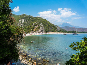 Scenic view of calm sea against cloudy sky