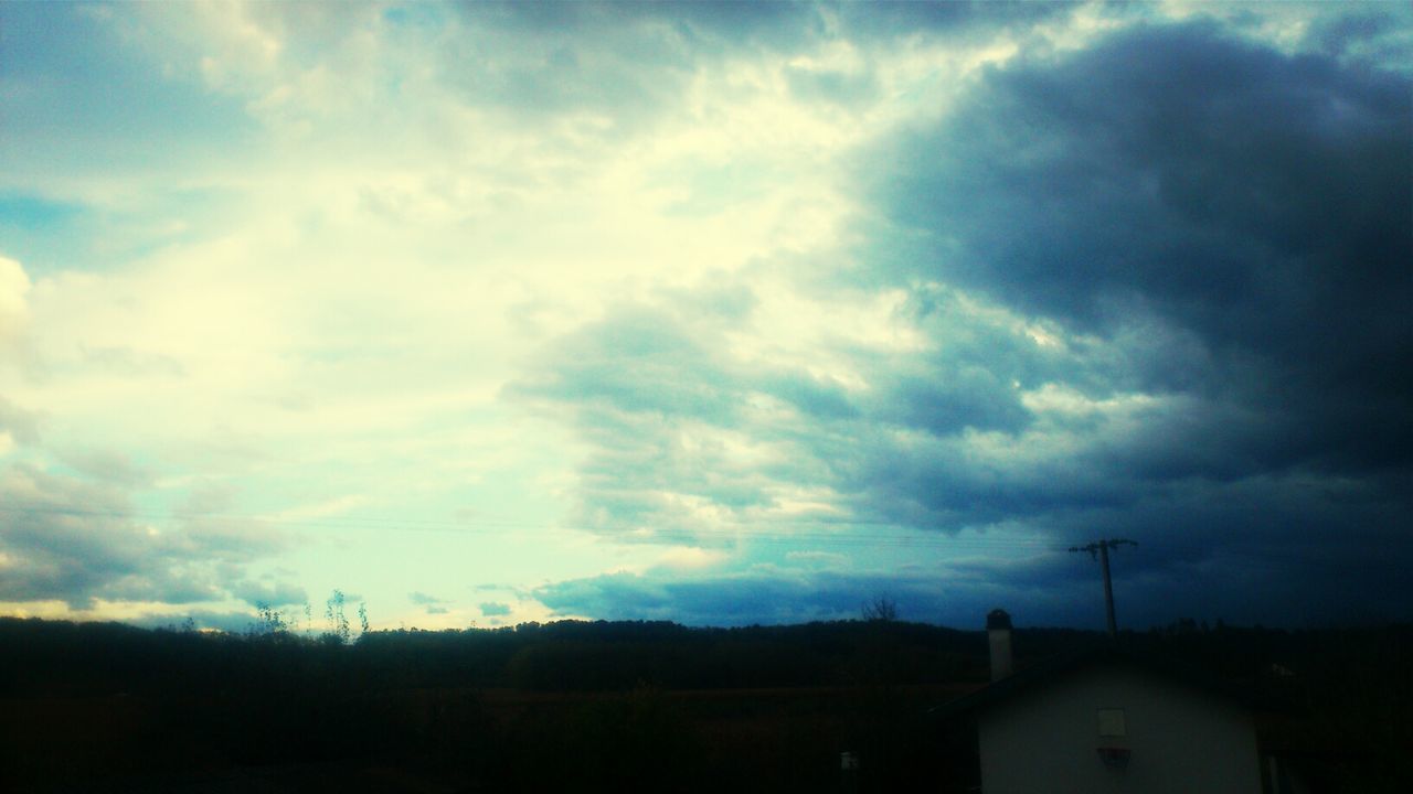 sky, cloud - sky, cloudy, weather, building exterior, silhouette, built structure, cloud, storm cloud, landscape, overcast, dusk, architecture, dramatic sky, beauty in nature, nature, scenics, cloudscape, house, low angle view