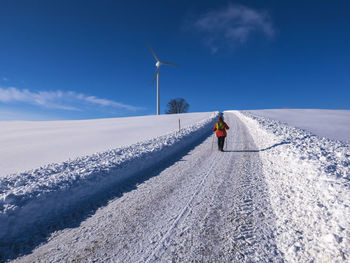 Germany, black forest, freiamt, person hiking on schillinger berg in winter