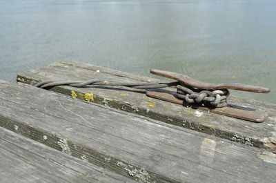 High angle view of rusty container on wooden table