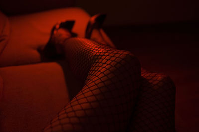 Low section of woman relaxing outdoors