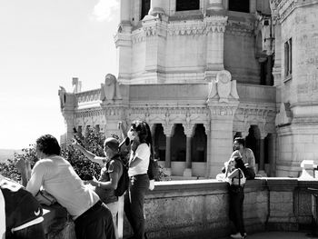 Group of people in front of historical building