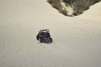 Tire tracks on sand at beach