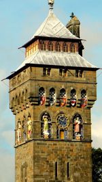 Low angle view of clock tower against sky