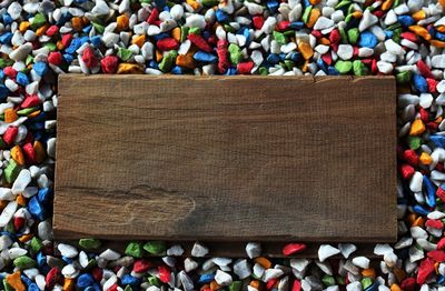 Directly above shot of wood amidst colorful candies