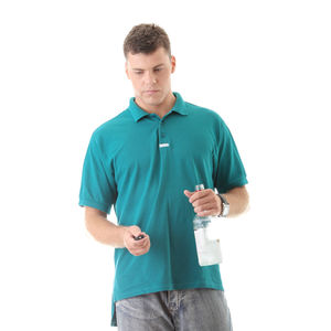 Portrait of young man standing against white background