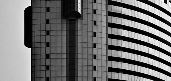 Low angle view of modern building against sky in city