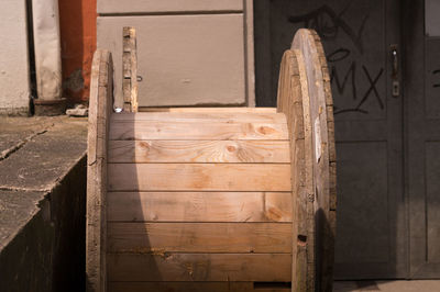 Wooden empty cable spools outside warehouse