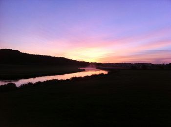 Scenic view of lake at sunset