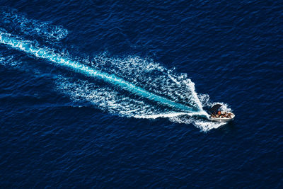 High angle view of boat sailing in sea