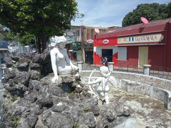 Horse cart on rock by building