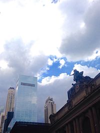 Low angle view of building against cloudy sky