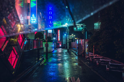 Illuminated city at night during rainy season