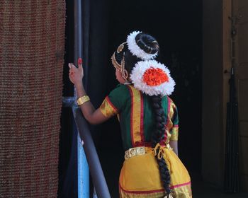 Rear view of girl in traditional cloth