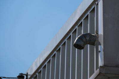 Low angle view of metallic structure against clear sky