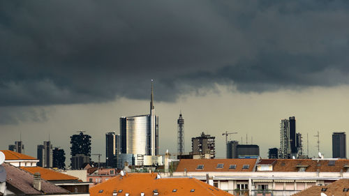 Buildings in city against sky