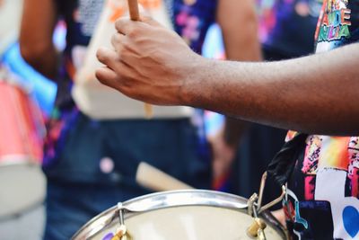 Close-up of man playing drum