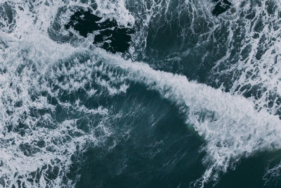 High angle view of water splashing in sea