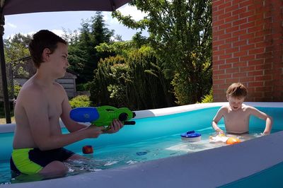 Children playing in swimming pool