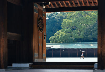 Woman seen through doorway