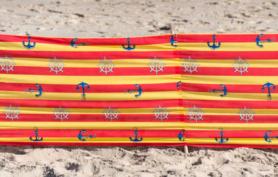 Beach screen on the polish beach on a sunny summer day in the background, sand from the beach.