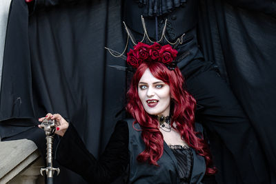 Portrait of young woman wearing costume during halloween