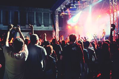 People enjoying music concert