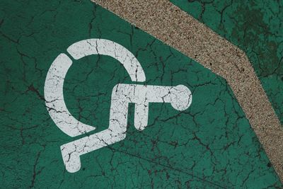 High angle view of disabled sign on road