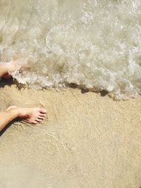 Low section of man on beach