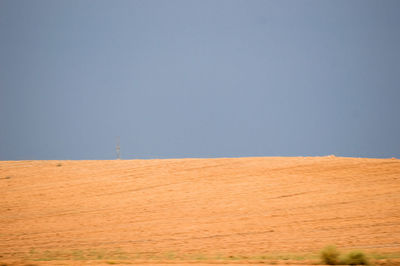 Scenic view of desert against clear sky