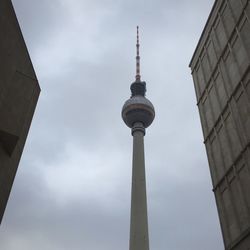 Low angle view of fernsehturm tower against sky