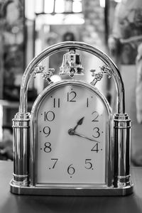 Close-up of clock on table