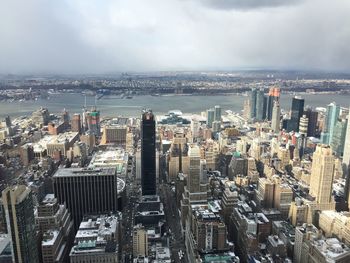 City skyline against cloudy sky