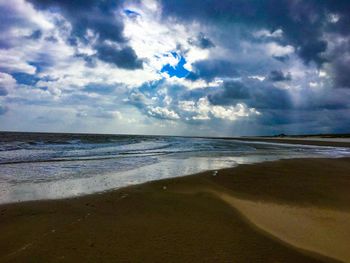 Scenic view of beach against sky