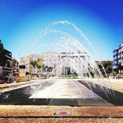 View of fountain against blue sky