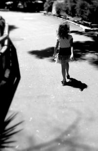 Woman standing on road