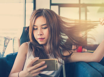 Young woman using mobile phone