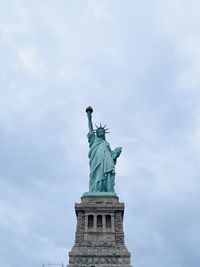 Low angle view of statue against sky