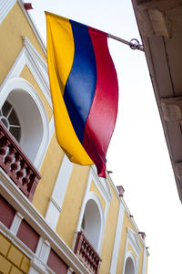 Low angle view of flags on building