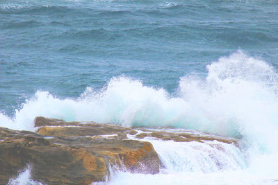 Waves splashing on rocks