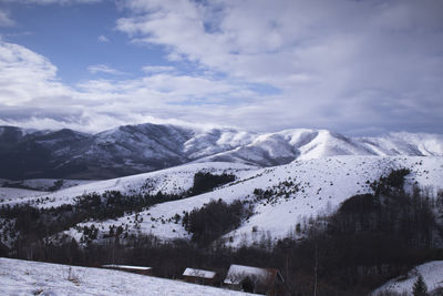 Scenic view of snowcapped mountains against sky