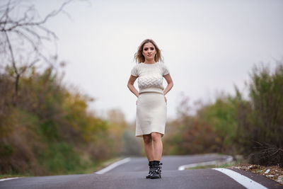 Full length of woman on road against sky