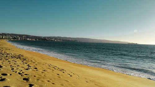 Scenic view of sea against clear blue sky