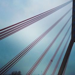 Low angle view of cables against sky