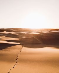 Scenic view of desert against clear sky