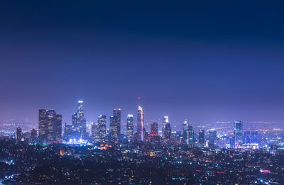 Illuminated buildings in city at night