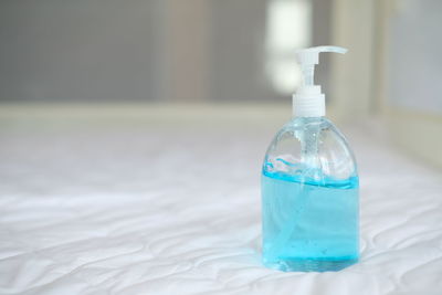 Close-up of water bottle on glass