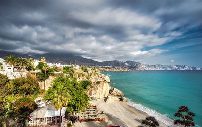 Panoramic view of city against cloudy sky